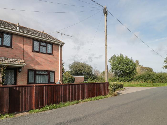 7 Bindon Lane, Wool, Dorset. Off-road parking. Garage storage. Close to shop and pub. Garden. 3 bed.