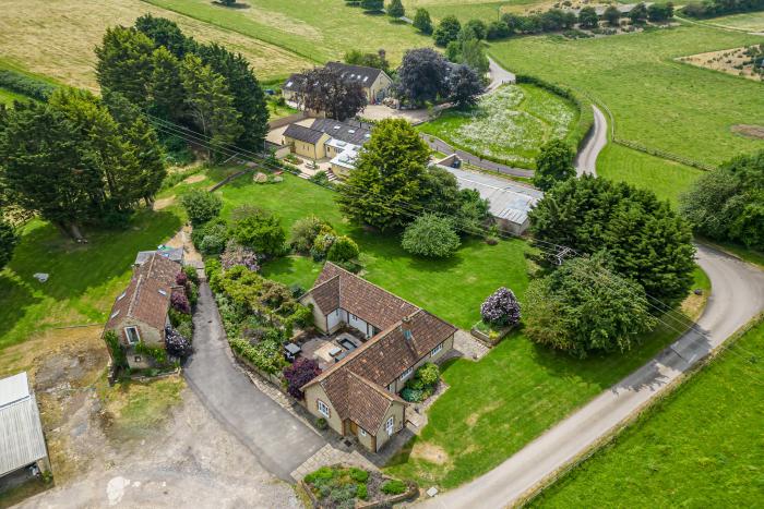 Leafield House in Upper Seagry, Wiltshire. Hot tub. Cinema room. Library. Freestanding bath. Luxury.