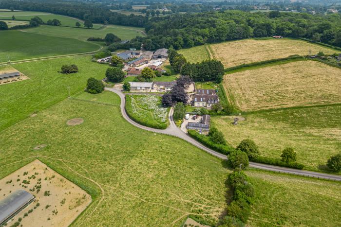 Leafield House in Upper Seagry, Wiltshire. Hot tub. Cinema room. Library. Freestanding bath. Luxury.