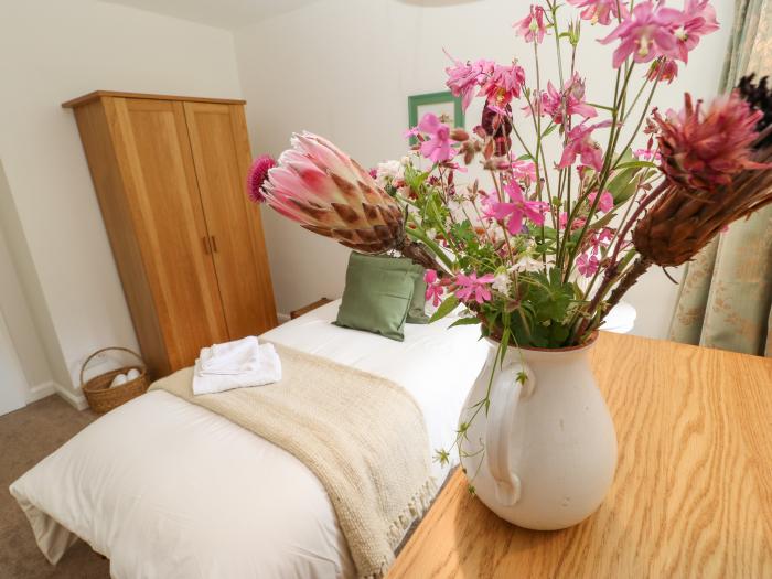 The Coach House rests near Corbridge, in Northumberland. Two-bedroom cottage, set rurally. Courtyard