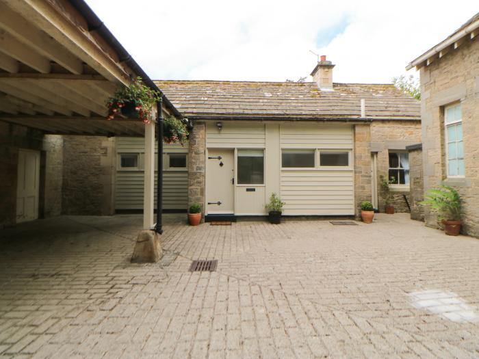 The Coach House rests near Corbridge, in Northumberland. Two-bedroom cottage, set rurally. Courtyard