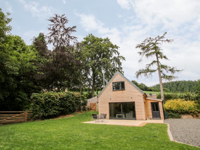 The Larches in Bryn near Clun, in Shropshire. Two-bedroom lodge, enjoying a woodland position. Rural