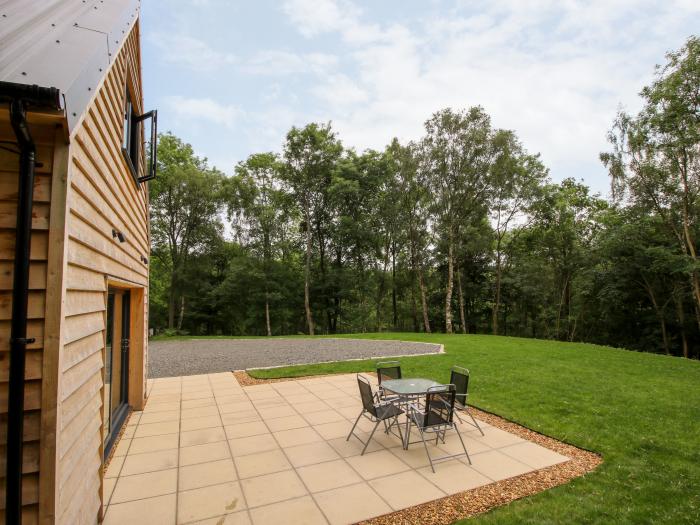 The Larches in Bryn near Clun, in Shropshire. Two-bedroom lodge, enjoying a woodland position. Rural