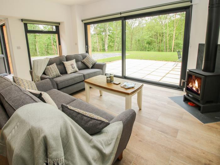 The Larches in Bryn near Clun, in Shropshire. Two-bedroom lodge, enjoying a woodland position. Rural