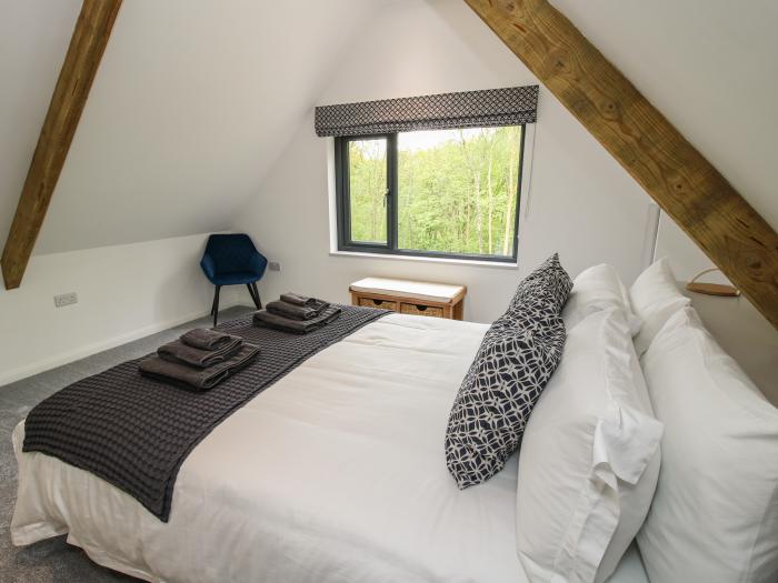 The Larches in Bryn near Clun, in Shropshire. Two-bedroom lodge, enjoying a woodland position. Rural