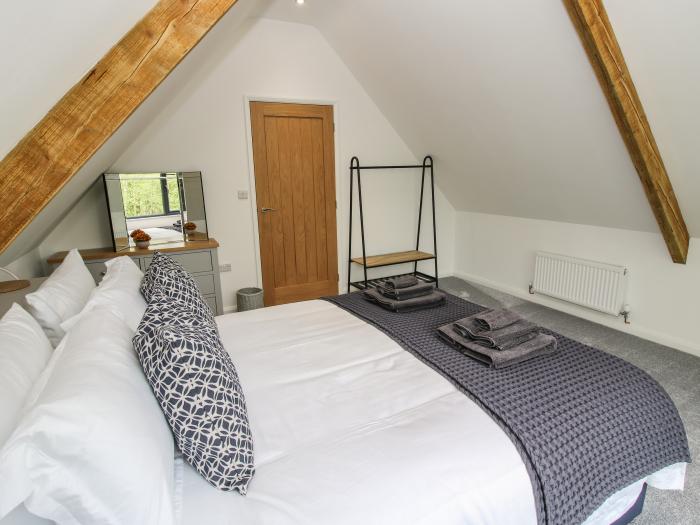 The Larches in Bryn near Clun, in Shropshire. Two-bedroom lodge, enjoying a woodland position. Rural