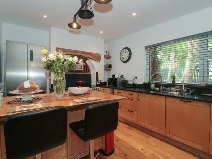 Brook Farm, rests near Ringwood, Hampshire. Four-bedroom home set rurally. Woodburning stove. Large.