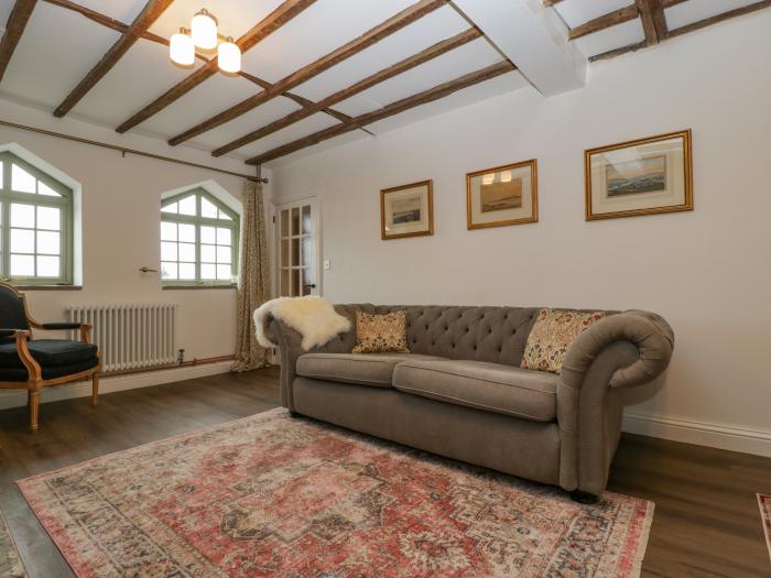 The Old Lodge is in Dymock near Newent, Gloucestershire, woodburning stove, off-road parking, 2beds.