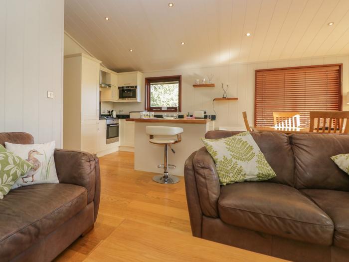 Leafy Nook is in Hawkshead, in Cumbria. Three-bedroom lodge with woodburning stove. In National Park