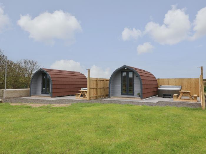 Parys Pod by Amlwch, Anglesey. Studio-style open-plan living, sofa bed, patio, hot tub, rural views.