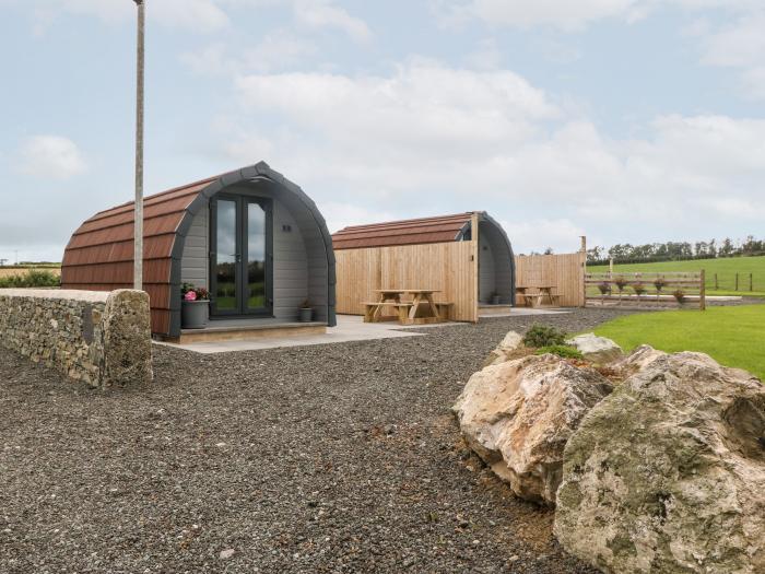 Parys Pod by Amlwch, Anglesey. Studio-style open-plan living, sofa bed, patio, hot tub, rural views.