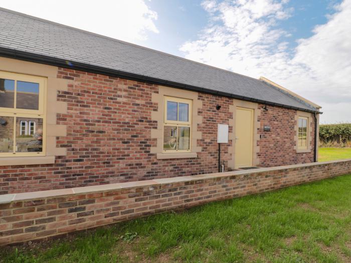 Smithy Cottage, Embleton, Northumberland. Single-storey cottage with an open-plan living space. WiFi