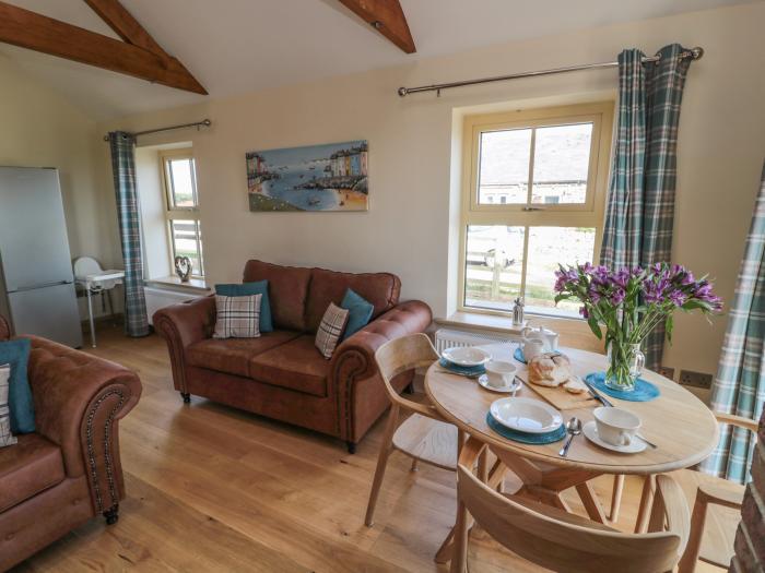 Smithy Cottage, Embleton, Northumberland. Single-storey cottage with an open-plan living space. WiFi