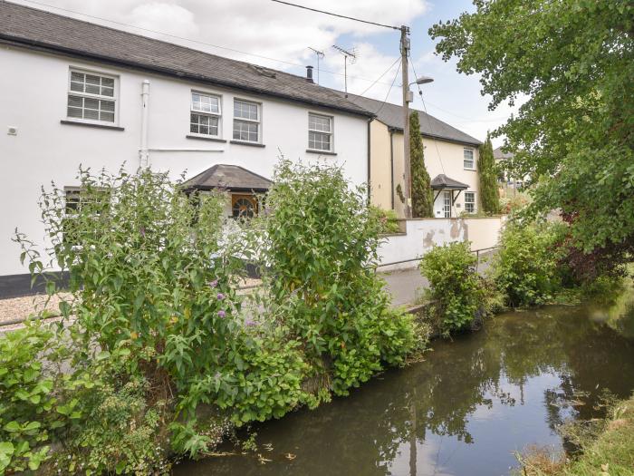 River Lym Cottage, Lyme Regis, Dorset. Garden & patio. Off-road parking. Two bedrooms. Pet-friendly.