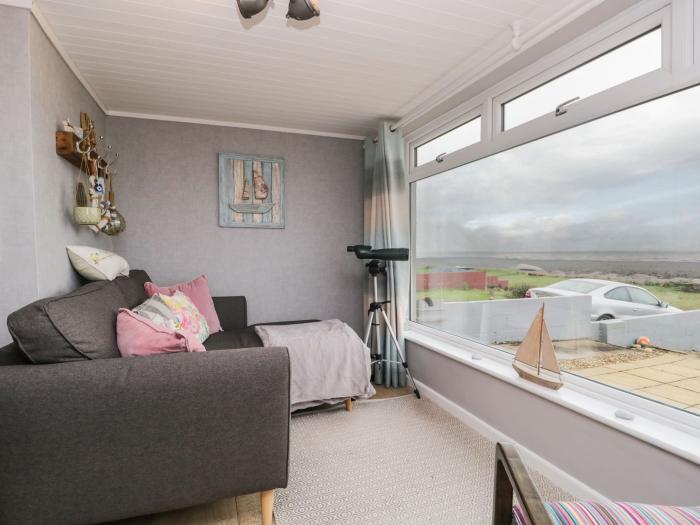 The Chalet is near Egremont, Cumbria. Single-storey chalet, overlooking Isle of Man. Pet-free. Rural