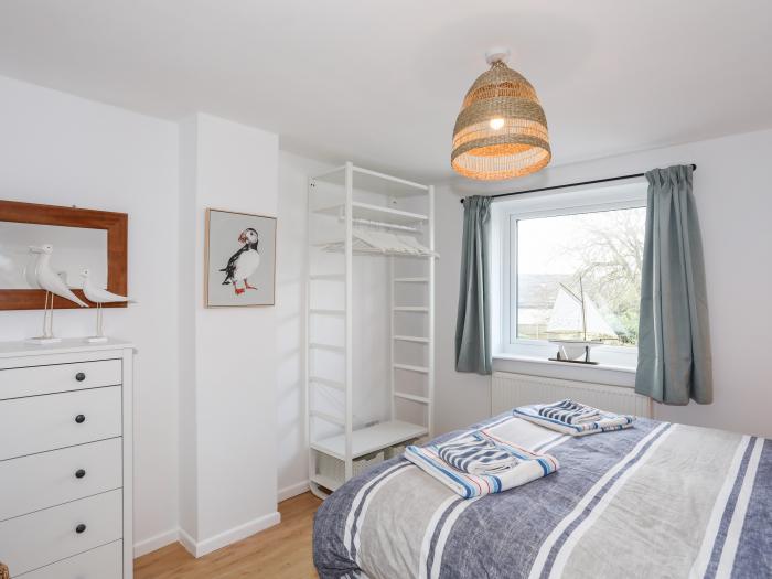 Awel Y Mor in Morfa Nefyn, Gwynedd. Open-plan living. Enclosed garden. Near a shop, pub and a beach.