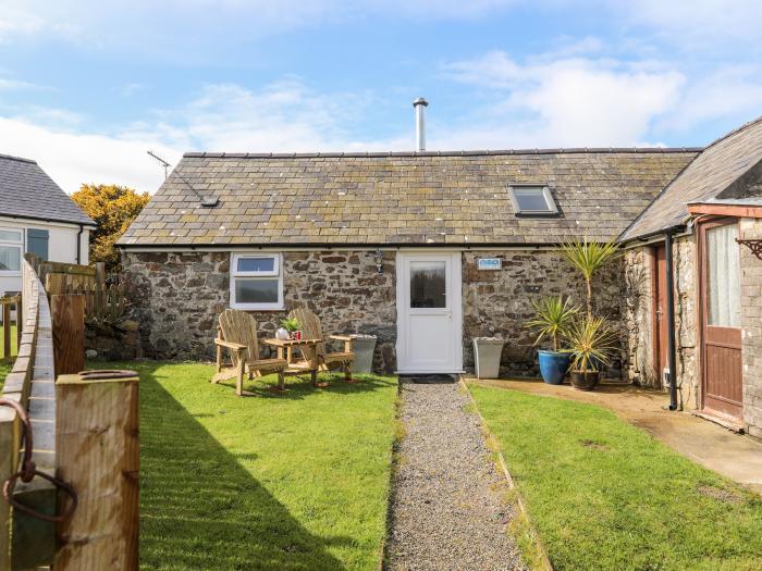 Cowshed in Abersoch, Gwynedd. One bedroom sleeping two guests. Enclosed garden, one pet, near beach.