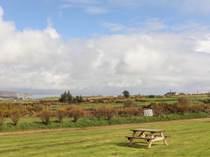 Cowshed in Abersoch, Gwynedd. One bedroom sleeping two guests. Enclosed garden, one pet, near beach.