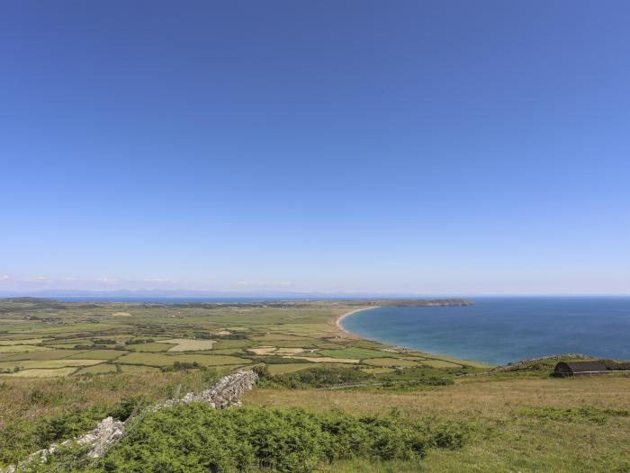 Cowshed in Abersoch, Gwynedd. One bedroom sleeping two guests. Enclosed garden, one pet, near beach.