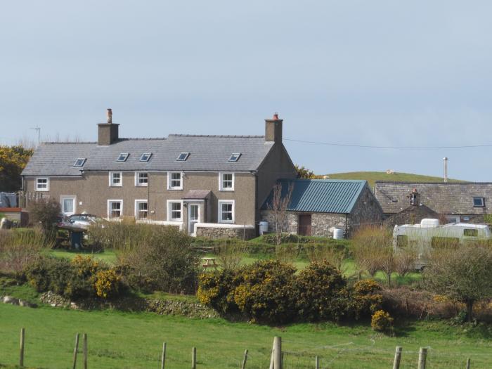 Cowshed in Abersoch, Gwynedd. One bedroom sleeping two guests. Enclosed garden, one pet, near beach.