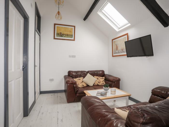 Cowshed in Abersoch, Gwynedd. One bedroom sleeping two guests. Enclosed garden, one pet, near beach.