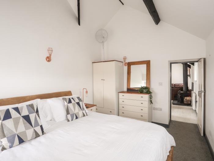 Cowshed in Abersoch, Gwynedd. One bedroom sleeping two guests. Enclosed garden, one pet, near beach.