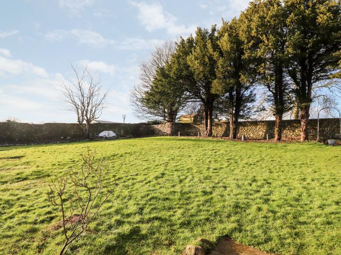 Hall Gowan in Carnforth, South Lakes. 3 bedrooms. Games room. Woodburning stove. Barbecue. Smart TVs