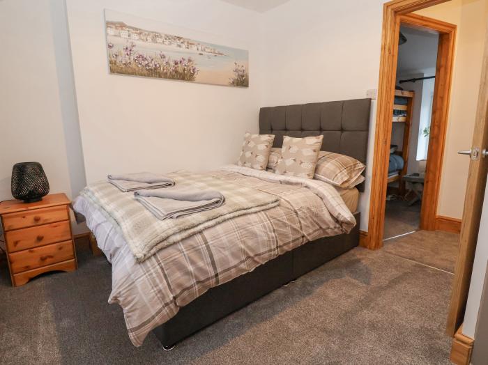 11 Wind Street rests in Conwy, North Wales. Two-bedroom home near amenities and attractions. Central