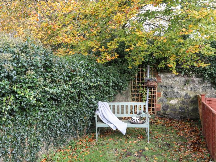 Ty Eiddew (Ivy Cottage), is near Criccieth in Gwynedd. Pet-friendly. Lawned garden. Roadside parking