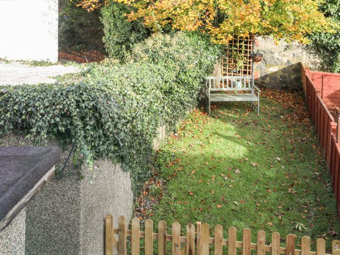 Ty Eiddew (Ivy Cottage), is near Criccieth in Gwynedd. Pet-friendly. Lawned garden. Roadside parking