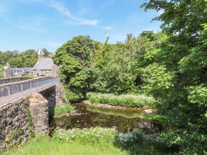 Ty Eiddew (Ivy Cottage), is near Criccieth in Gwynedd. Pet-friendly. Lawned garden. Roadside parking