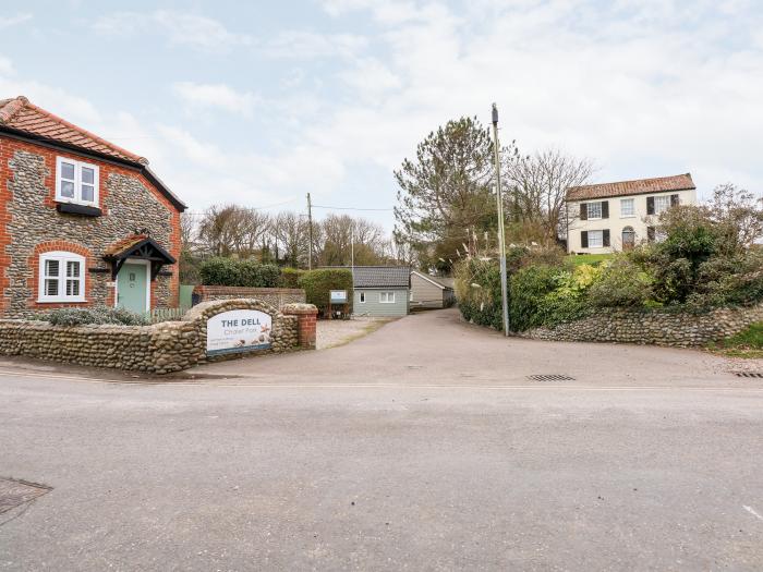 1 The Dell in Mundesley, Norfolk. Single-storey chalet inviting four guests and 2 well-behaved dogs.