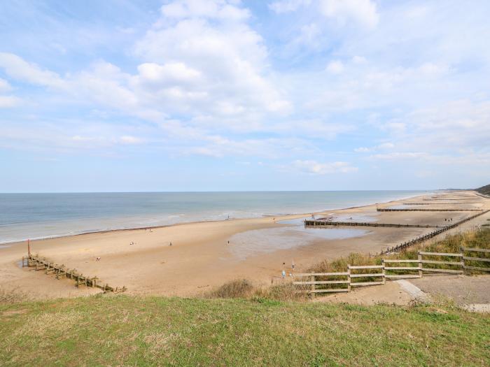 1 The Dell in Mundesley, Norfolk. Single-storey chalet inviting four guests and 2 well-behaved dogs.