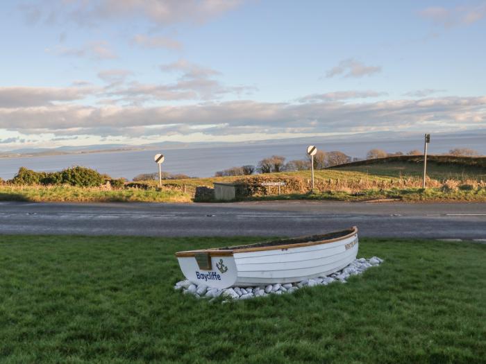 Still Waters, Baycliff, Cumbria. Set paces from the sea. Ideal for couples. Enclosed patio. Two pets