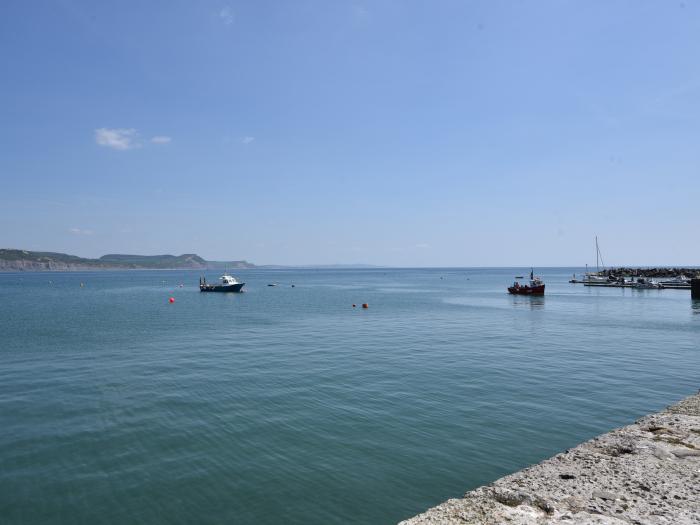 The Old Garage Lyme Regis, Dorset. Off-road parking. Enclosed garden. Dog-friendly. En-suite bedroom