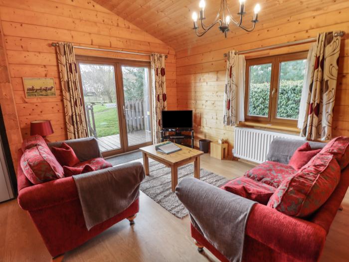 Swan Lodge in Stainfield, Bardney, Lincolnshire, sleeps two guests in one bedroom. One dog, hot tub.