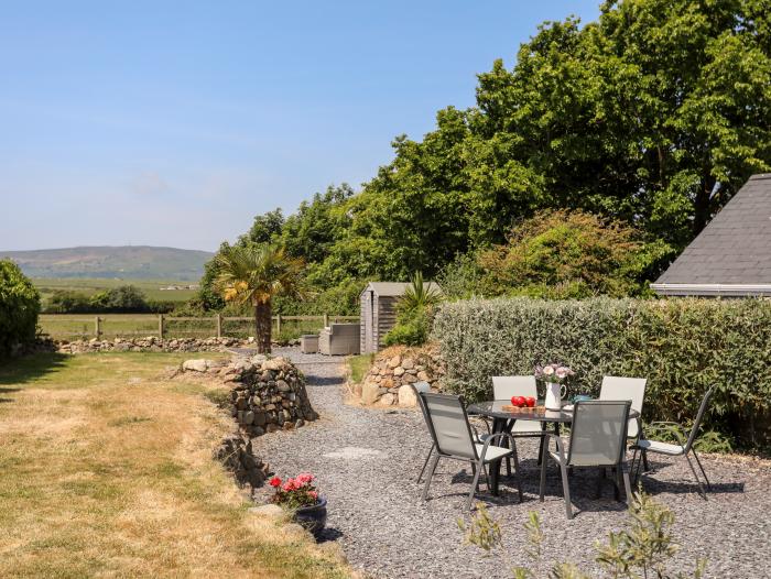 Tan Y Fynwent in Abersoch, Gwynedd, dog-friendly, enclosed garden, close to beach, garden furniture.