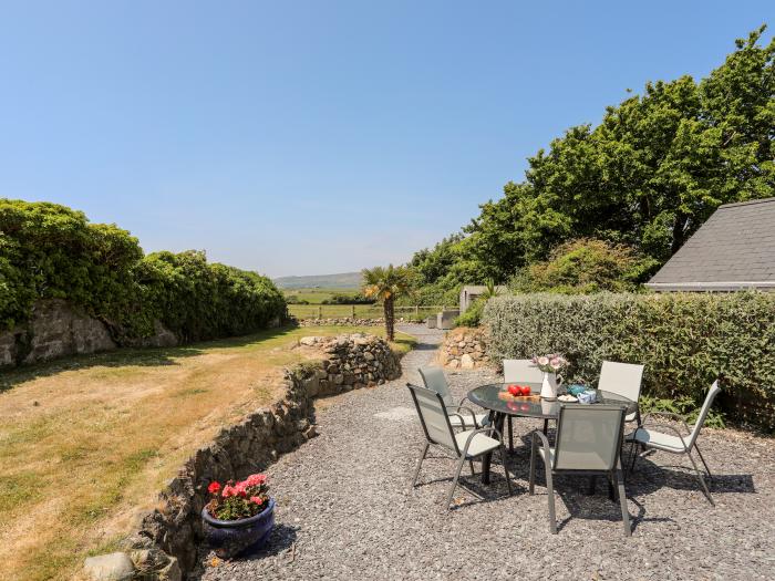 Tan Y Fynwent in Abersoch, Gwynedd, dog-friendly, enclosed garden, close to beach, garden furniture.