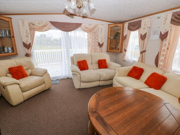 Park Lane near Kilgetty in Pembrokeshire sleeps six in three bedrooms. Family-friendly. Pet-friendly