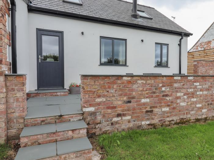 Forge Cottage is near Trefnant, Denbighshire. Two-bedroom barn conversion, resting rurally. Hot tub.