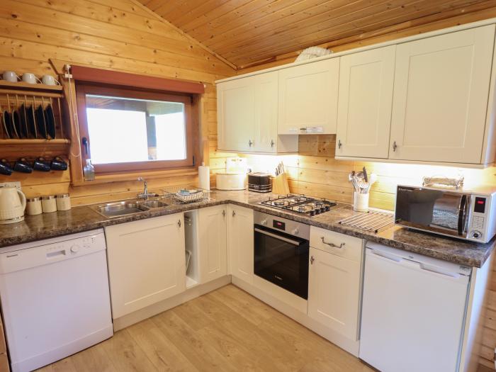 Tawny Lodge in Stainfield, Lincolnshire, sleeps four guests in two bedrooms. Pets & off-road parking