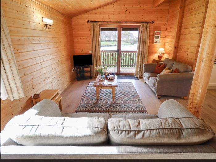 Tawny Lodge in Stainfield, Lincolnshire, sleeps four guests in two bedrooms. Pets & off-road parking