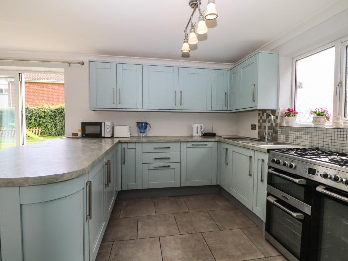 Alverstone Seaside near Gosport, Hampshire. Three-bedroom home set near amenities and coast. Garden.