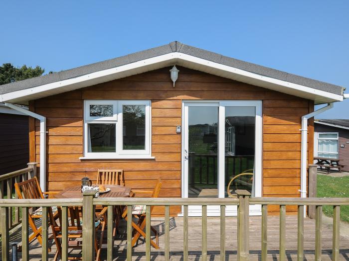 Little Trebah in Atlantic Bays Holiday Park in Cornwall. Decking with furniture. On-site facilities.