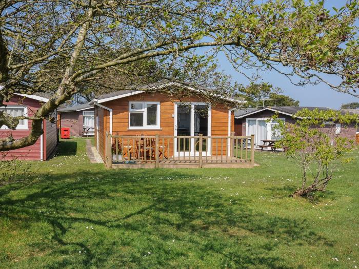 Little Trebah in Atlantic Bays Holiday Park in Cornwall. Decking with furniture. On-site facilities.