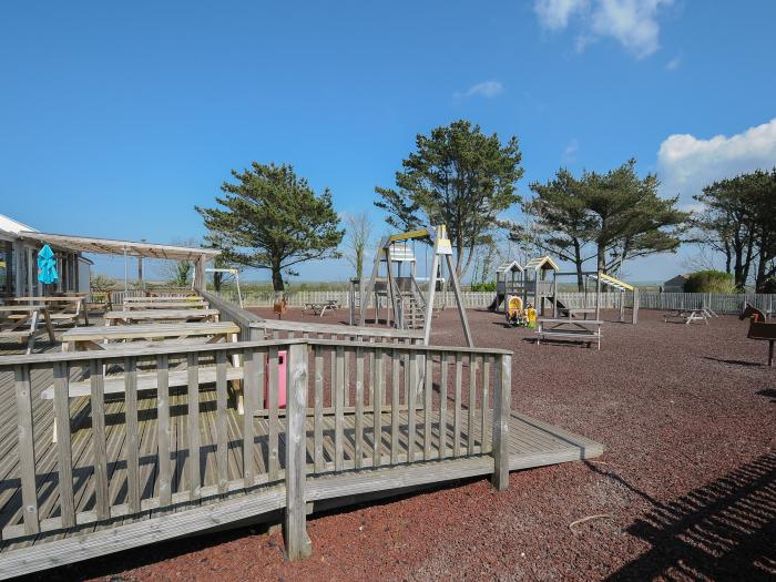 Little Trebah in Atlantic Bays Holiday Park in Cornwall. Decking with furniture. On-site facilities.