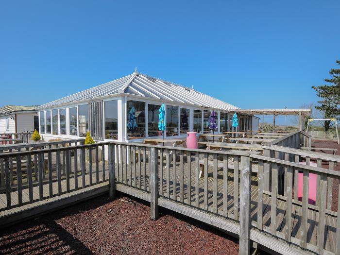 Little Trebah in Atlantic Bays Holiday Park in Cornwall. Decking with furniture. On-site facilities.