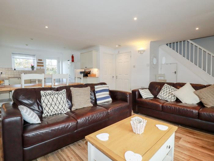 Eventide, Newquay, Cornwall. Four-bedroom home, near amenities. Off-road parking. Open-plan living.