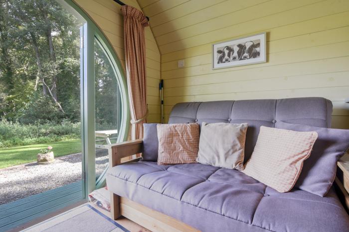 Pendragon Pod, Axminster, Devon. Near an AONB. Off-road parking. Pet-friendly. Outdoor seating area.