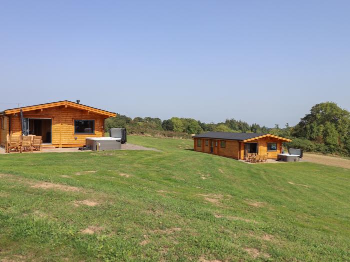 Primrose Lodge in Hittisleigh, Devon. Detached lodge. Open-plan living space with woodburning stove.